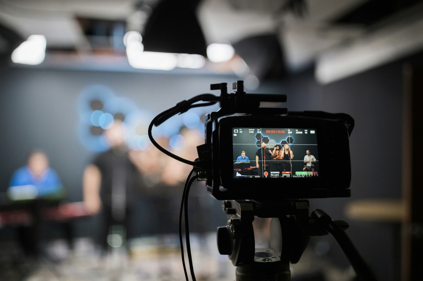 A camera filming a presenter in a studio